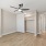 Bedroom with a Ceiling Fan at Our Newly-Renovated Apartments in Glendale, CO