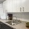 Modern Kitchen with Undermount Sink and Gooseneck Faucet at Our Belcaro Apartments in Denver 